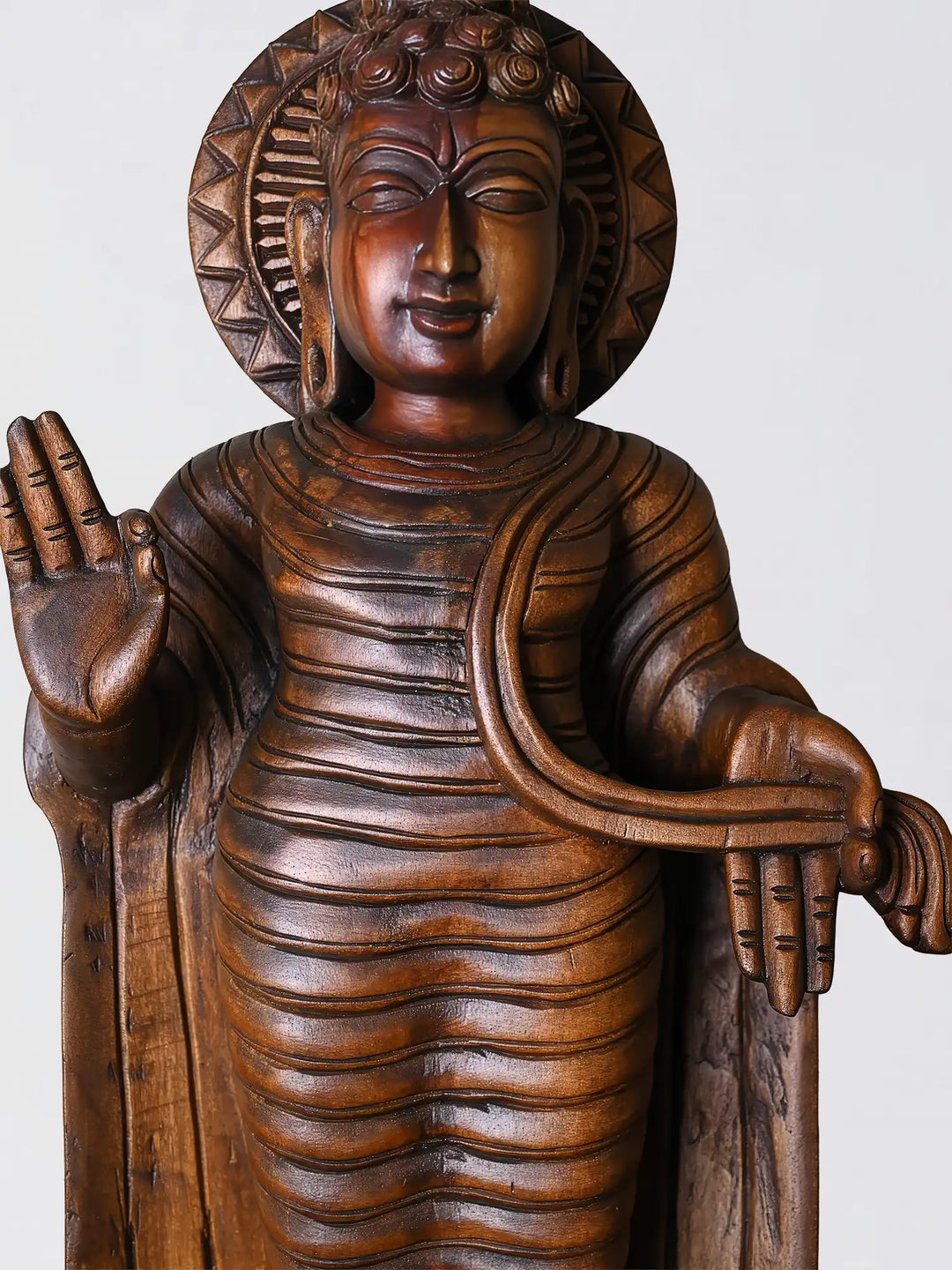 wooden Buddha statue close up face detailing