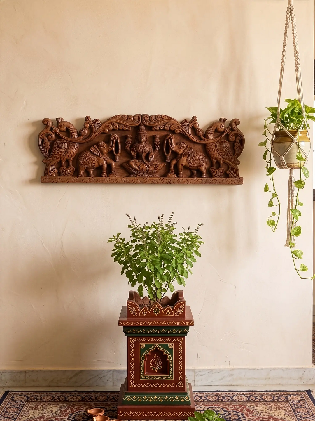 Decorative wooden wall panel with intricate carvings above a plant stand with a plant on a beige wall.