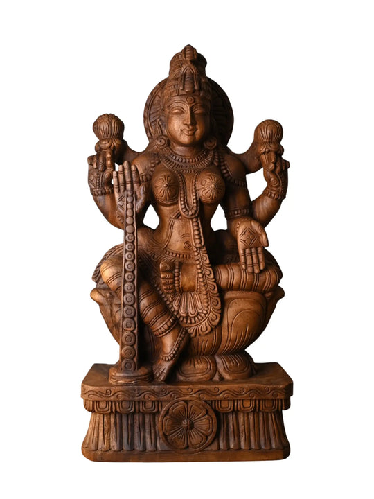 Traditional Goddess Lakshmi idol in detailed wood carving