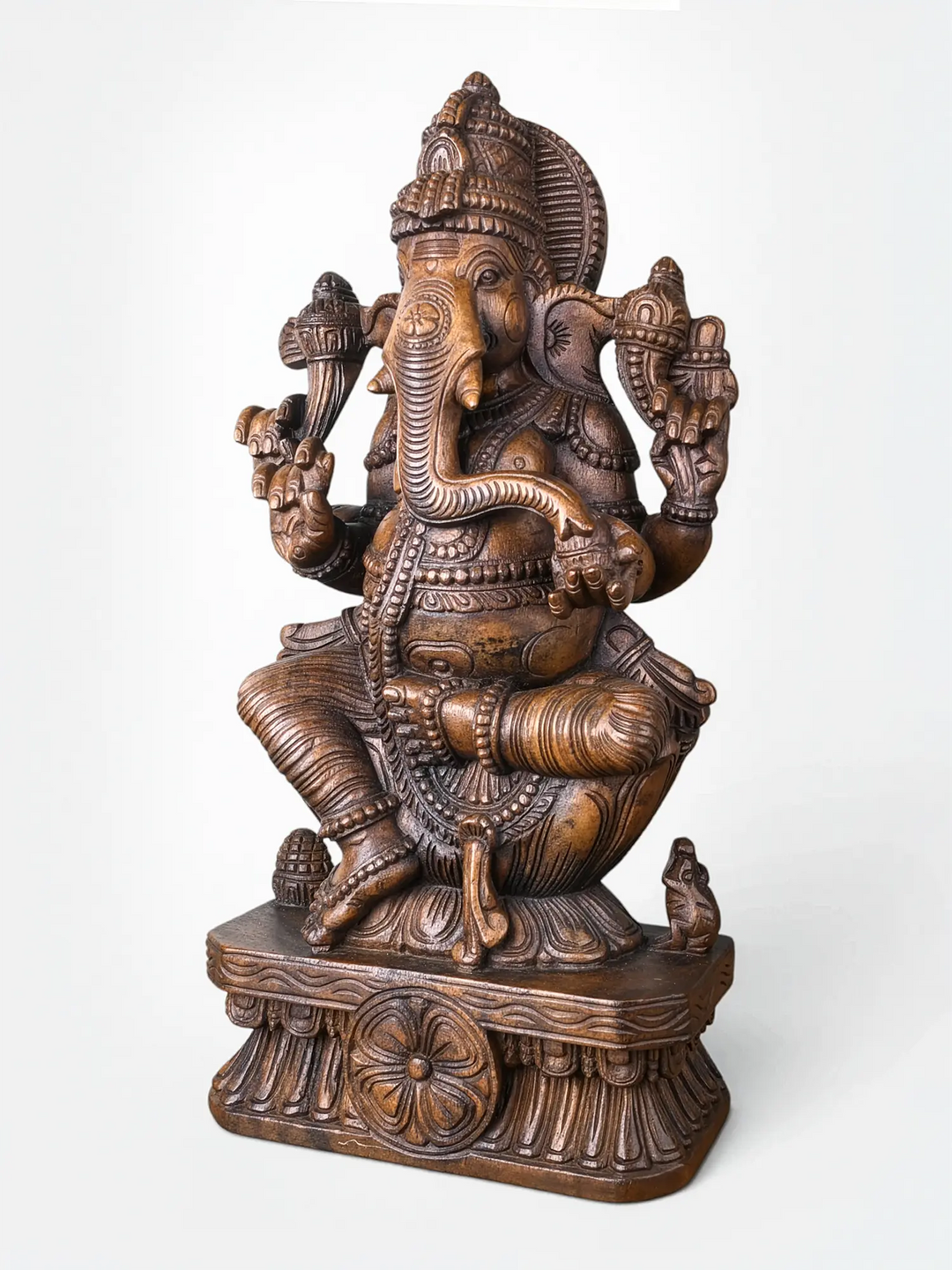 Handcrafted wooden Ganesha sculpture with intricate traditional carving