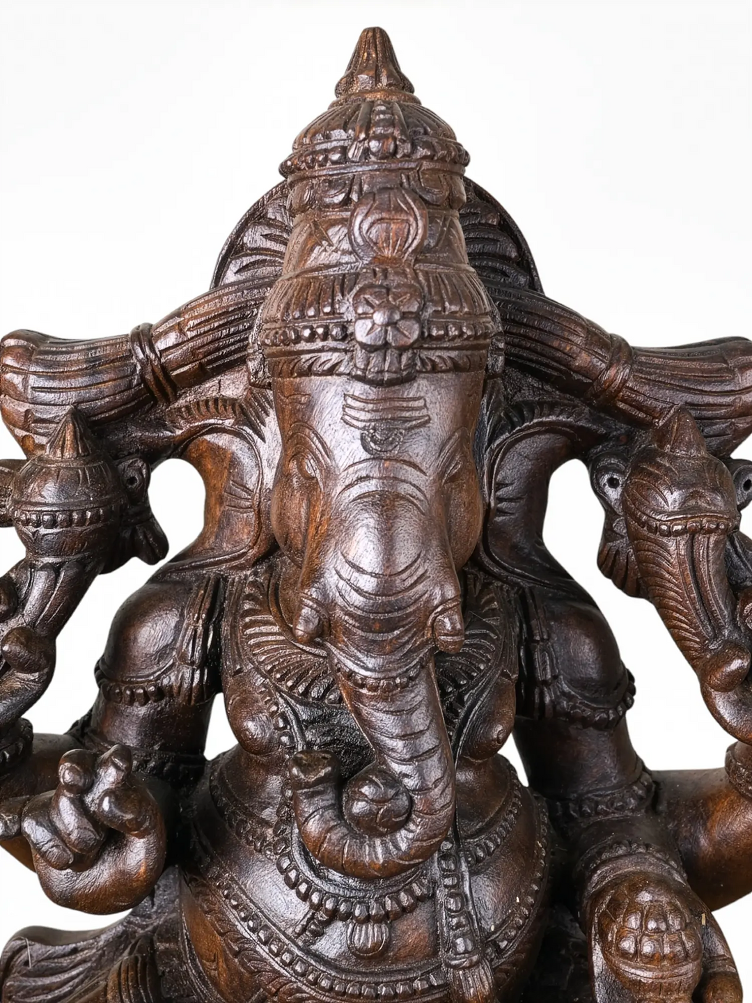 Traditional Indian wooden Ganapathi carving with natural wood finish