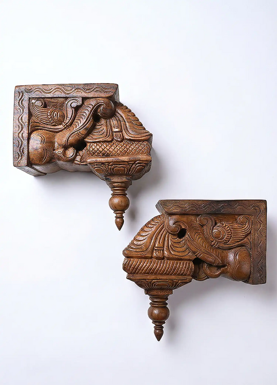 Decorative wooden corbels with peacock carvings for pooja room and wall decoration.