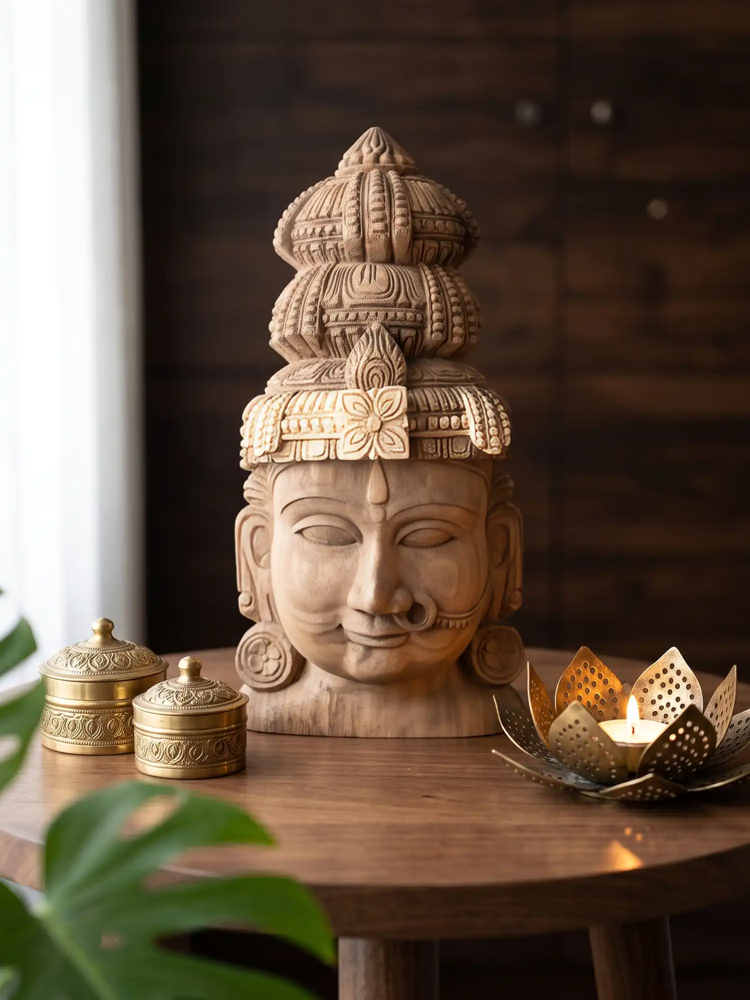 Elegant solid wood goddess face with intricate crown design for traditional interior decoration.