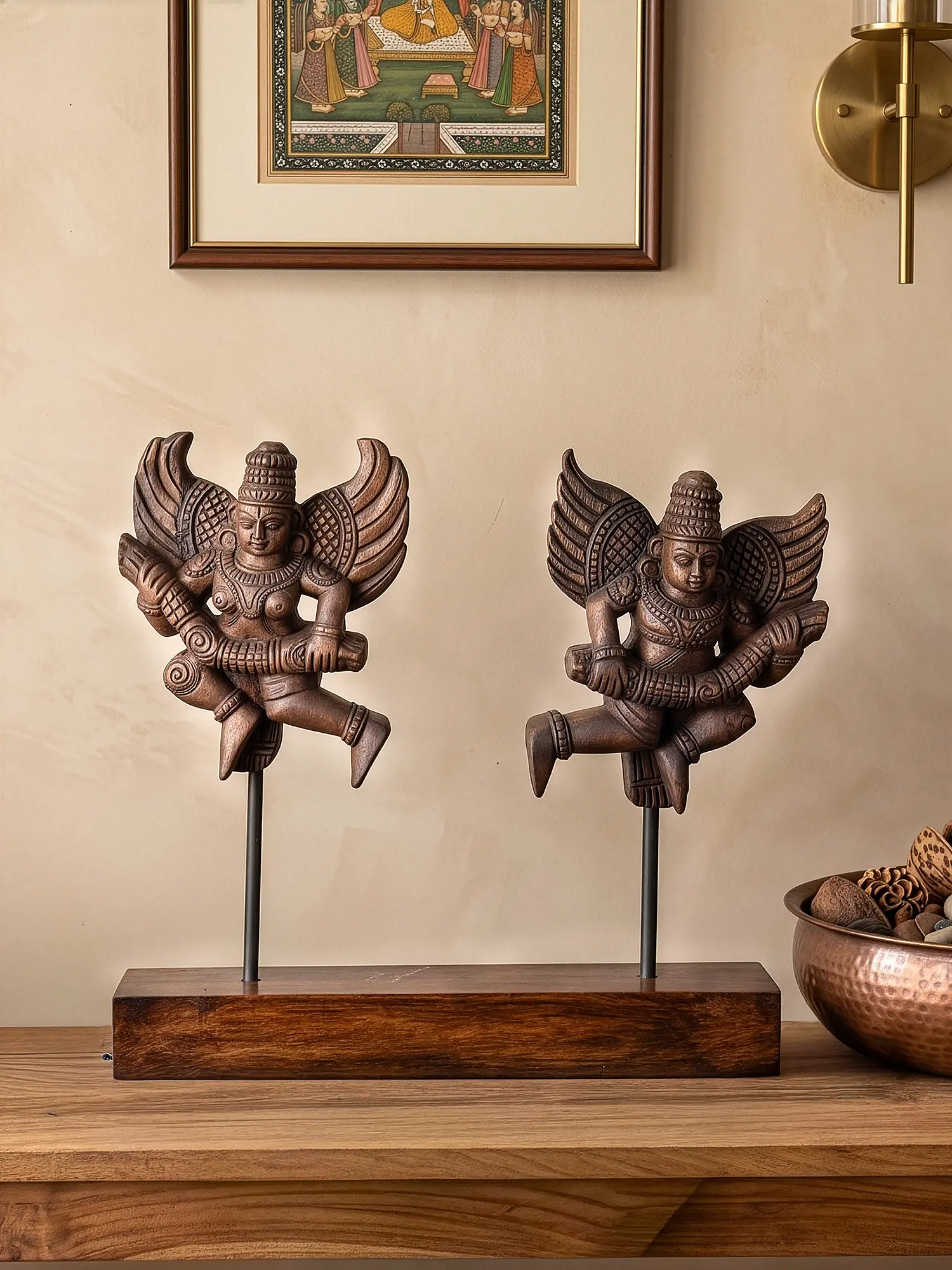 Premium wooden Garuda sculptures displayed on solid wooden base.