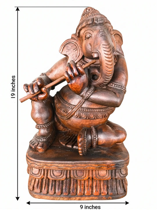Wooden musical Ganesha statue for office décor.