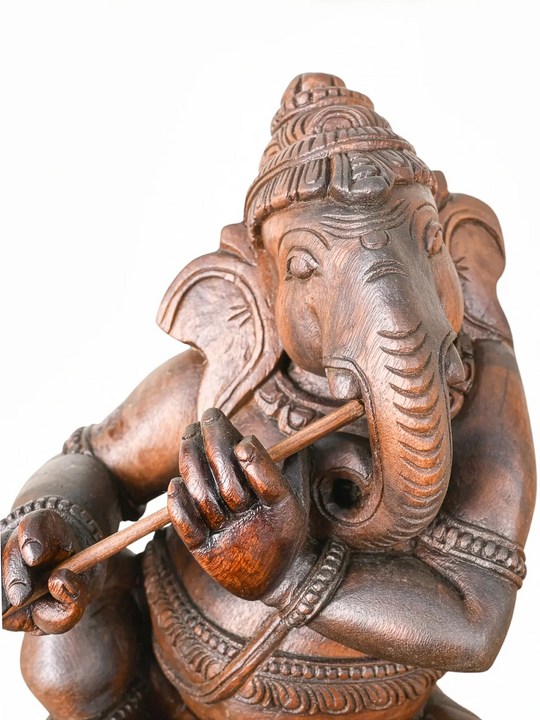 Premium solid wood flute playing Lord Ganesha.