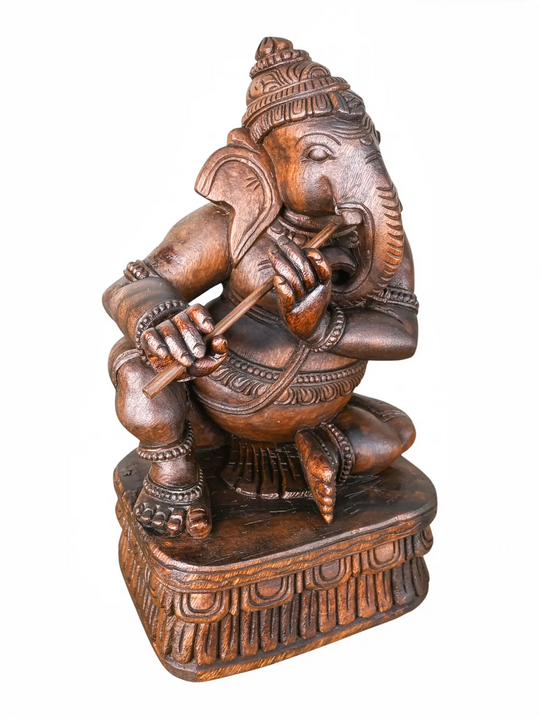 Handmade wooden Ganesha idol with intricate carving.
