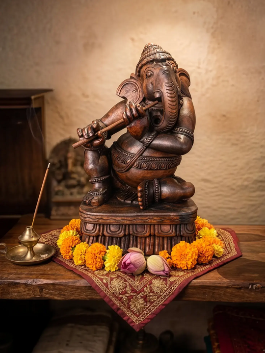 Wooden musical Ganesha statue for office décor.