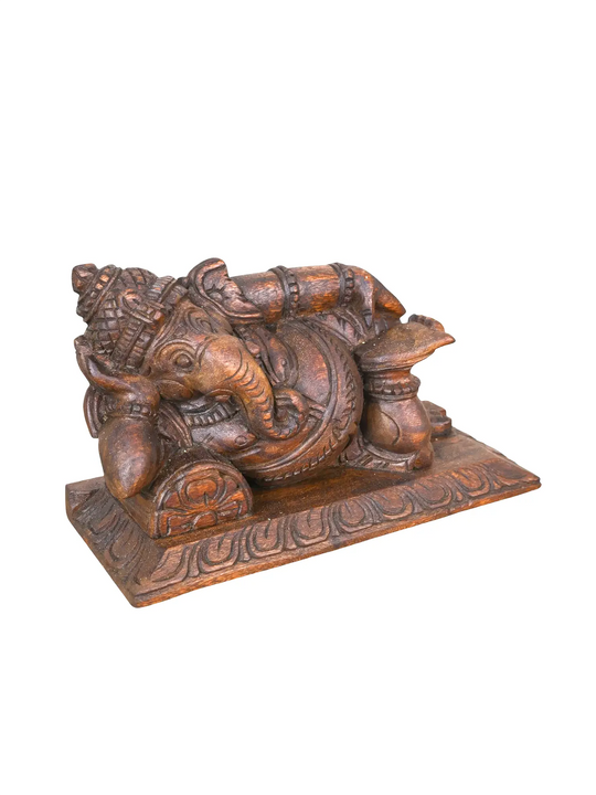 Wooden resting Lord Ganesh idol for home temple decoration.