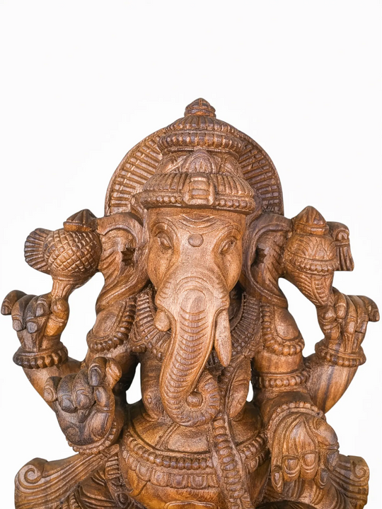 Finely handcrafted wooden Lord Ganesha artwork showcasing timeless Indian wood carving traditions.