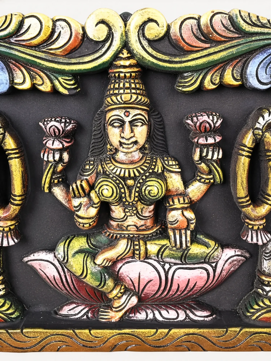 Traditional wooden Gajalakshmi wall panel with twin elephants and detailed multicolour carving