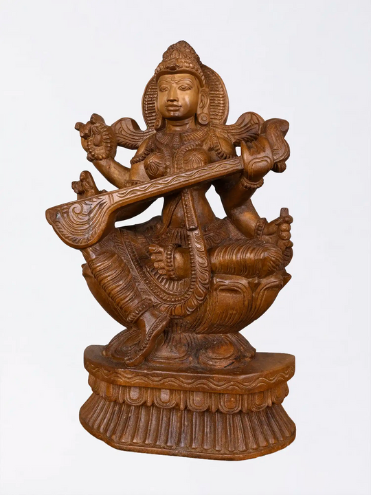 Carved wooden Saraswathi goddess sculpture
