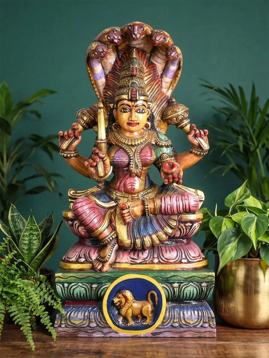 Traditional Mariamman goddess wooden statue under Panchamukha Naga