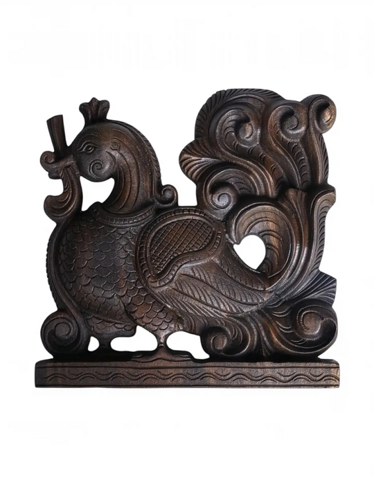 Side profile of a wooden Annapakshi corbel showing intricate relief