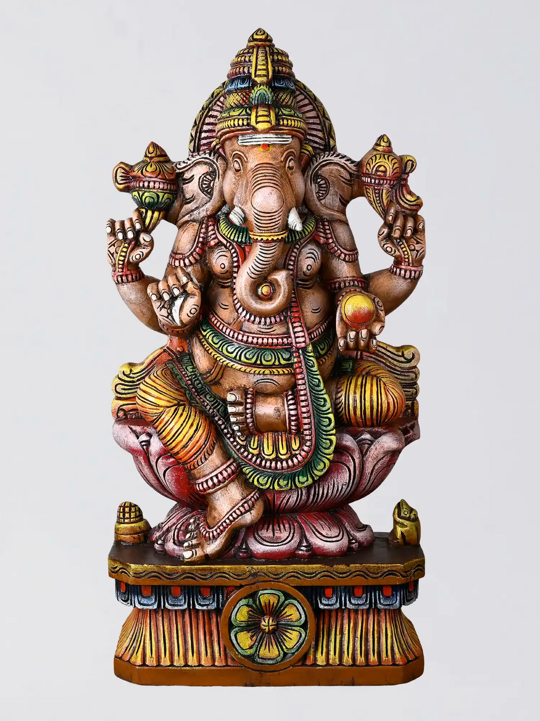 Multicoloured Ganesh wooden statue with traditional Indian carving