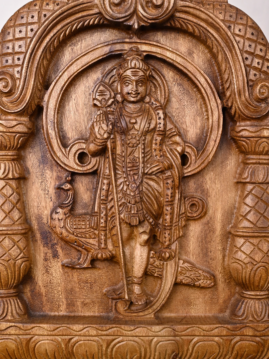 Traditional wooden Lord Murugan wall carving