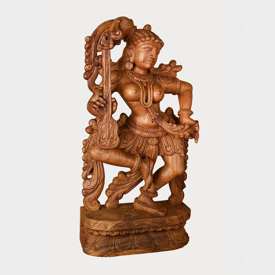 handcrafted wooden apsara playing instrumen