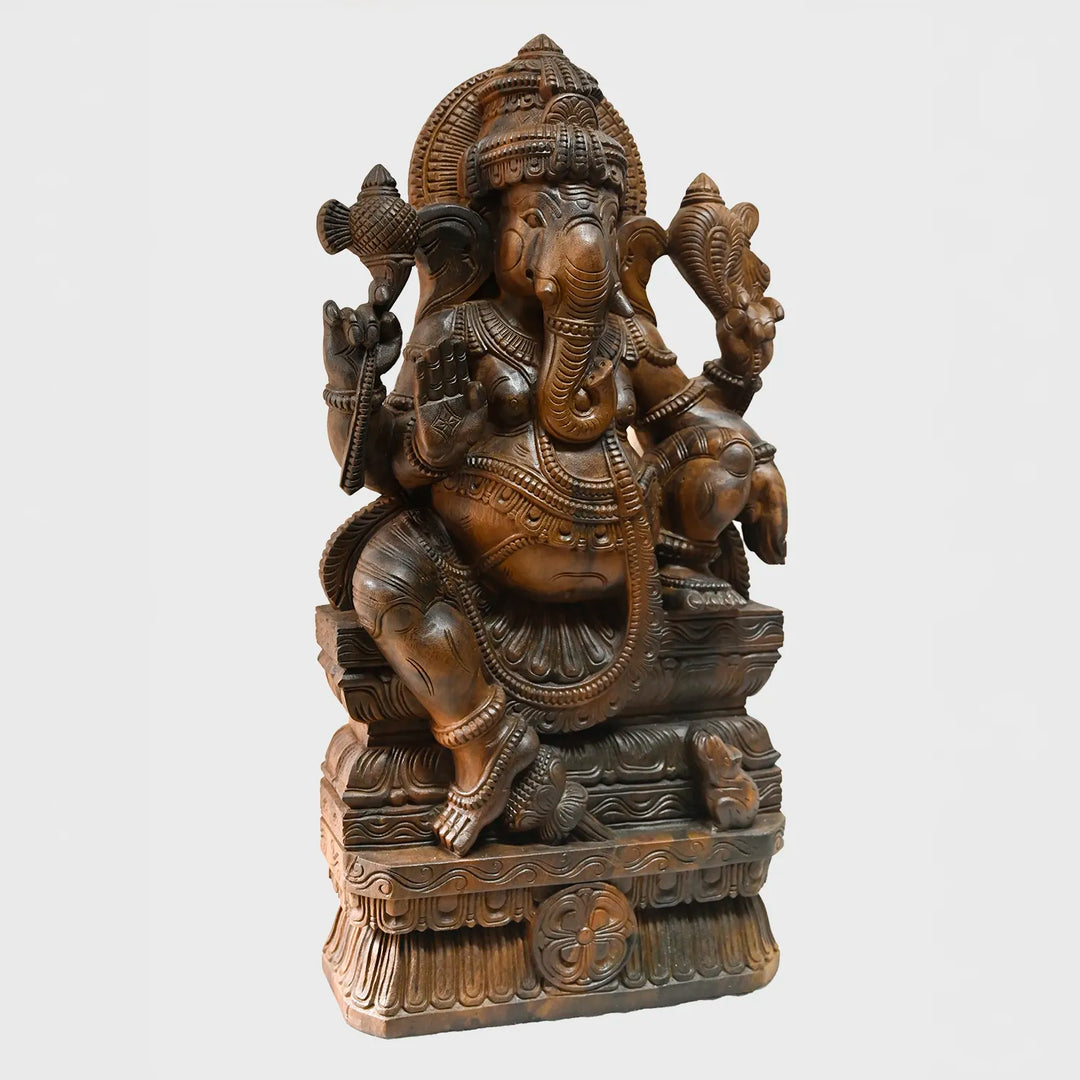 Lord Ganesh majestically seated wooden sculpture