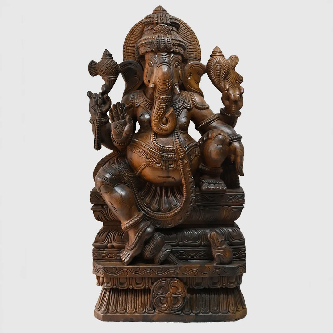 Lord Ganesh majestically seated wooden sculpture