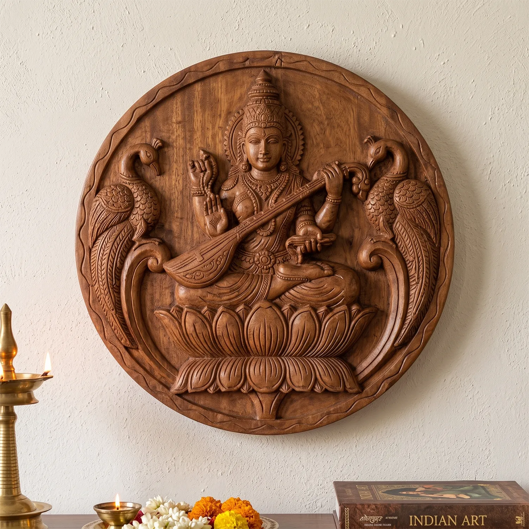 Indian wooden deity wall panel featuring Saraswathi