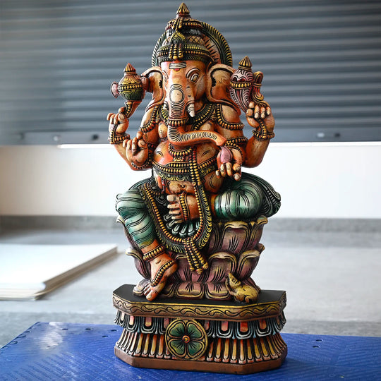 Multicoloured wooden Ganesh statue for pooja room