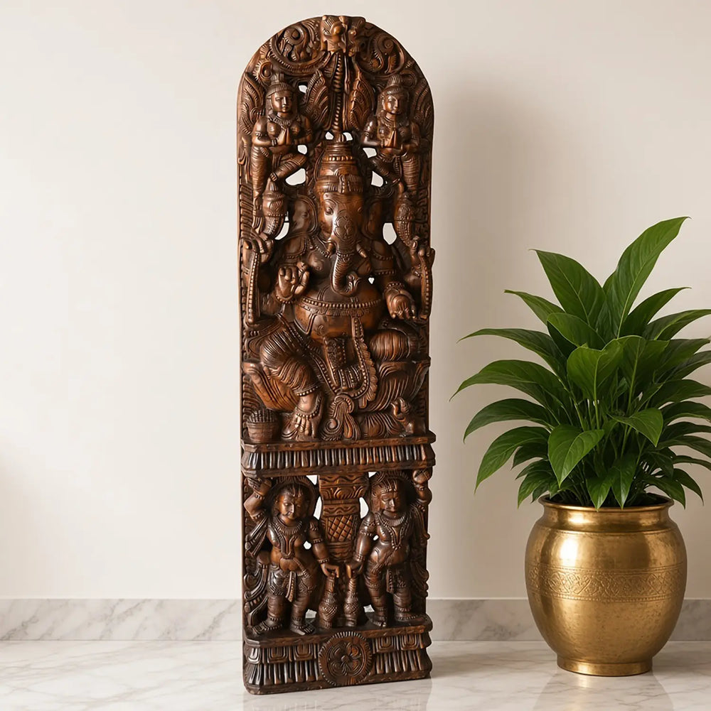 Wooden Ganesha statue with intricate temple-style carving
