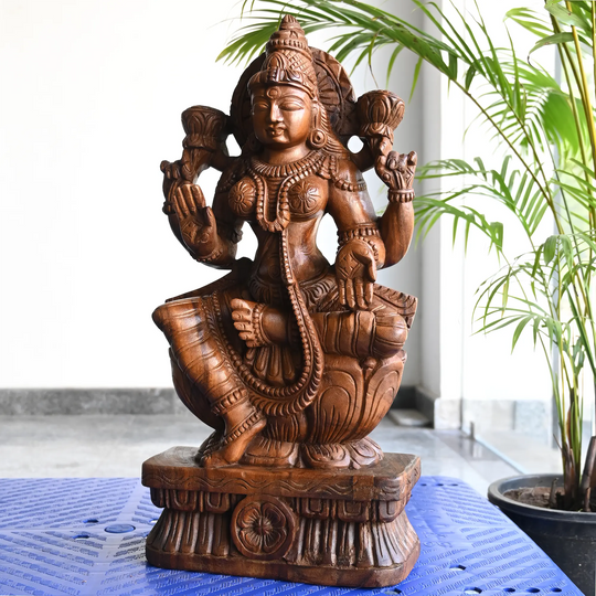 Handcrafted Lakshmi Devi wood carving by Indian artisans