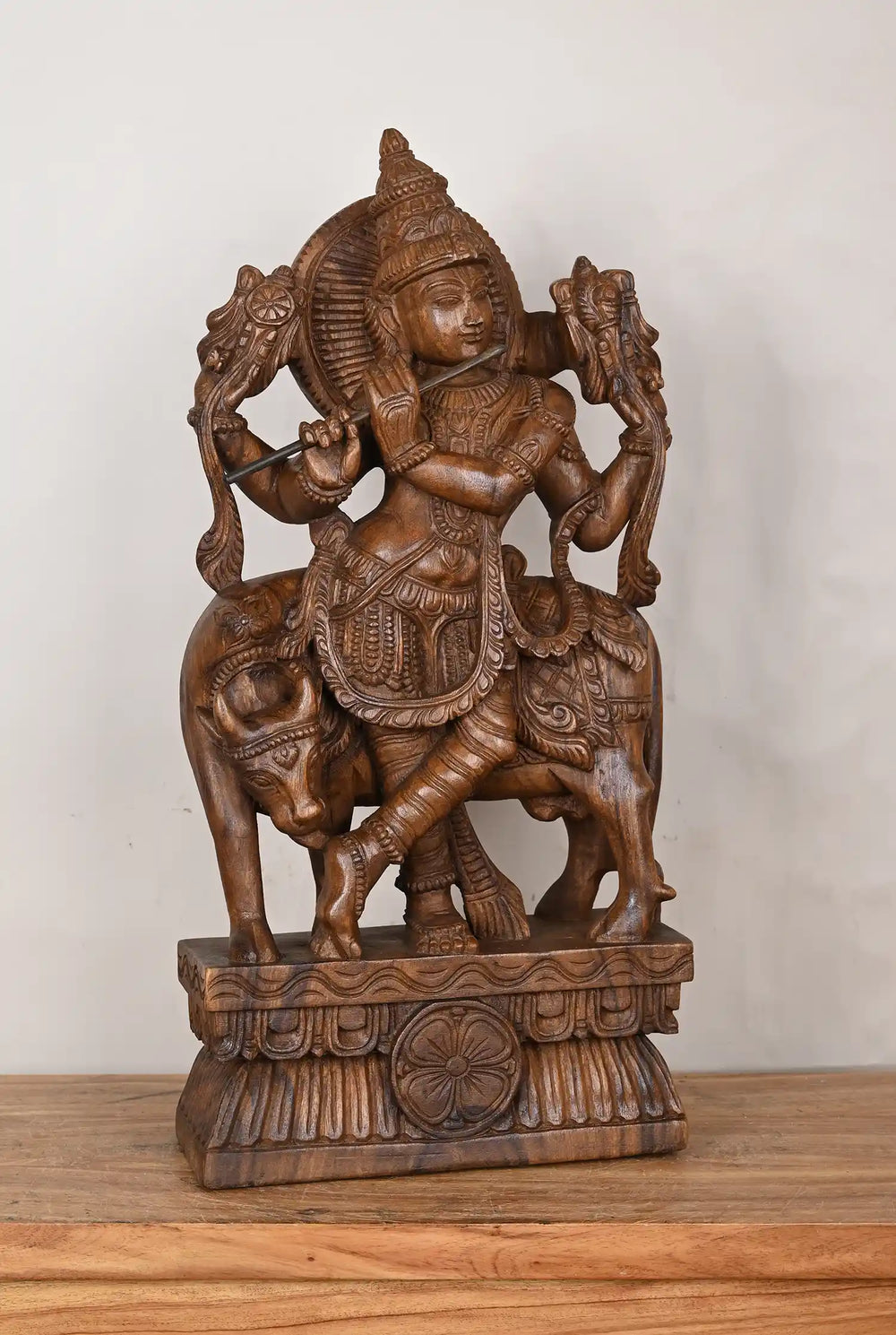 Lord krishna staue with cow