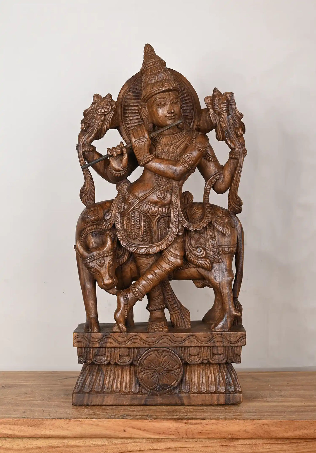 Lord krishna staue with cow