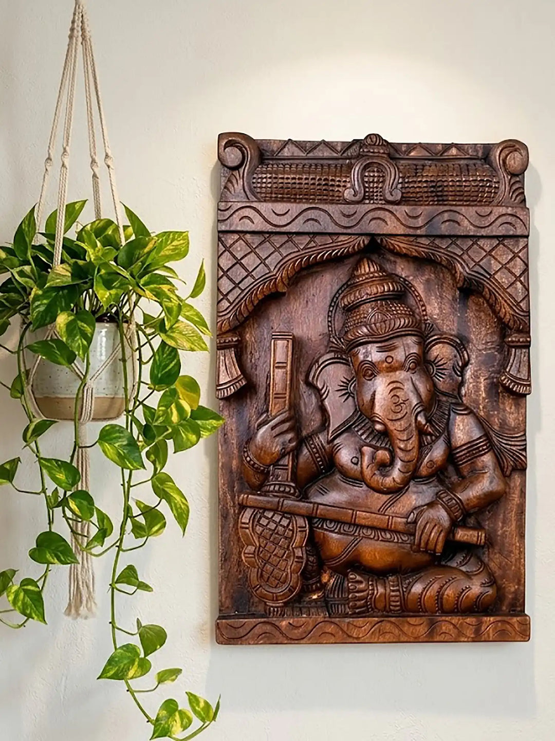 Handcrafted wooden Ganesha playing Veena wall Panel