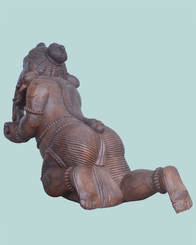 Baby Ganesh Holding Ladoo Wooden sculpture 16"